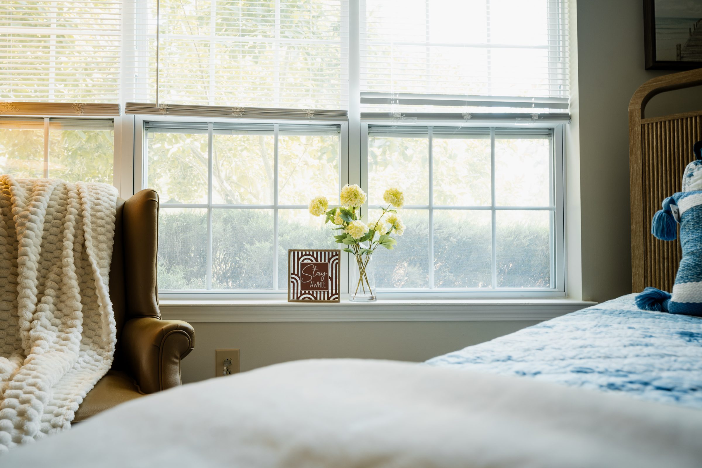 Assisted living apartment bedroom by the window