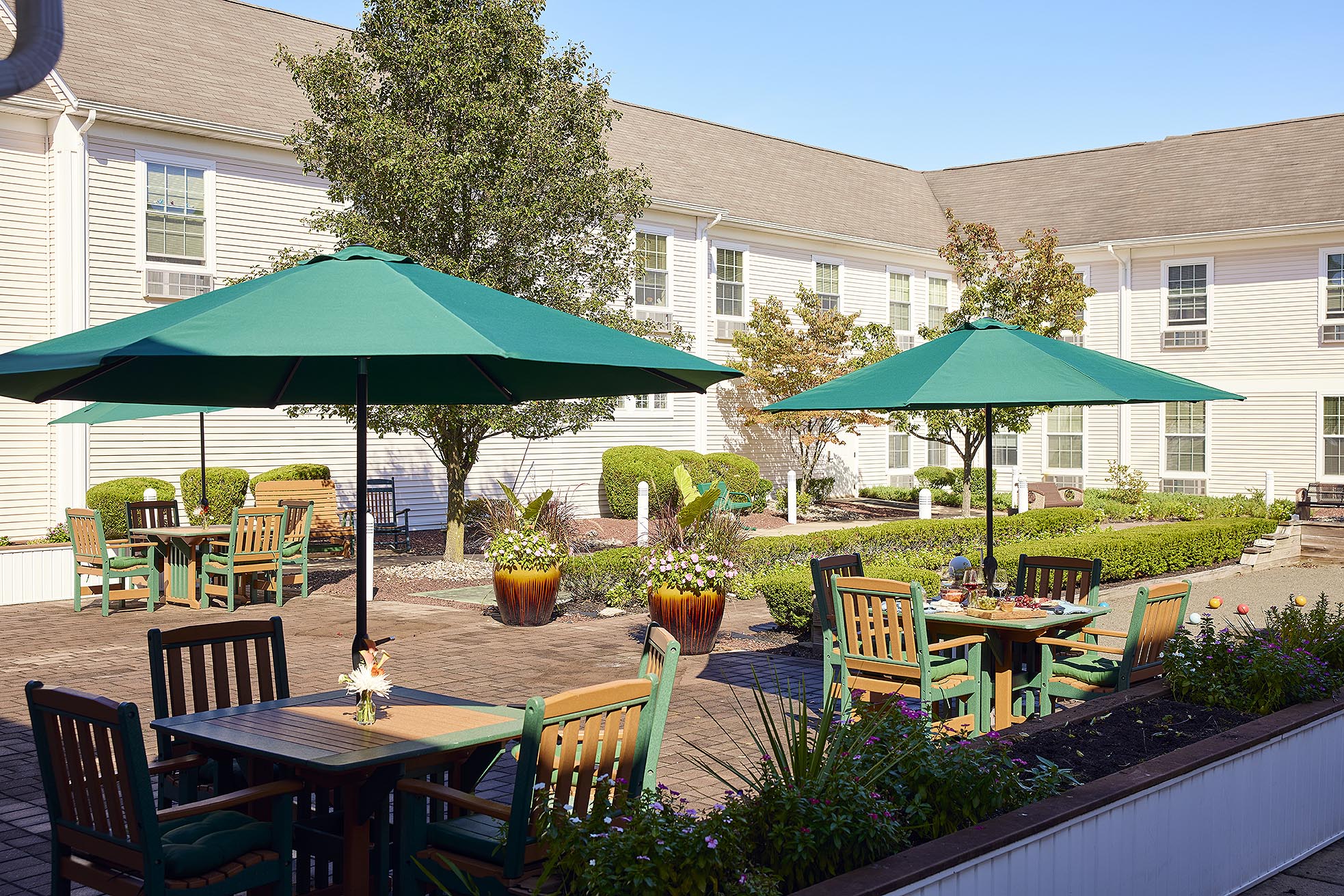 Tables and chairs with umbrellas on the patio